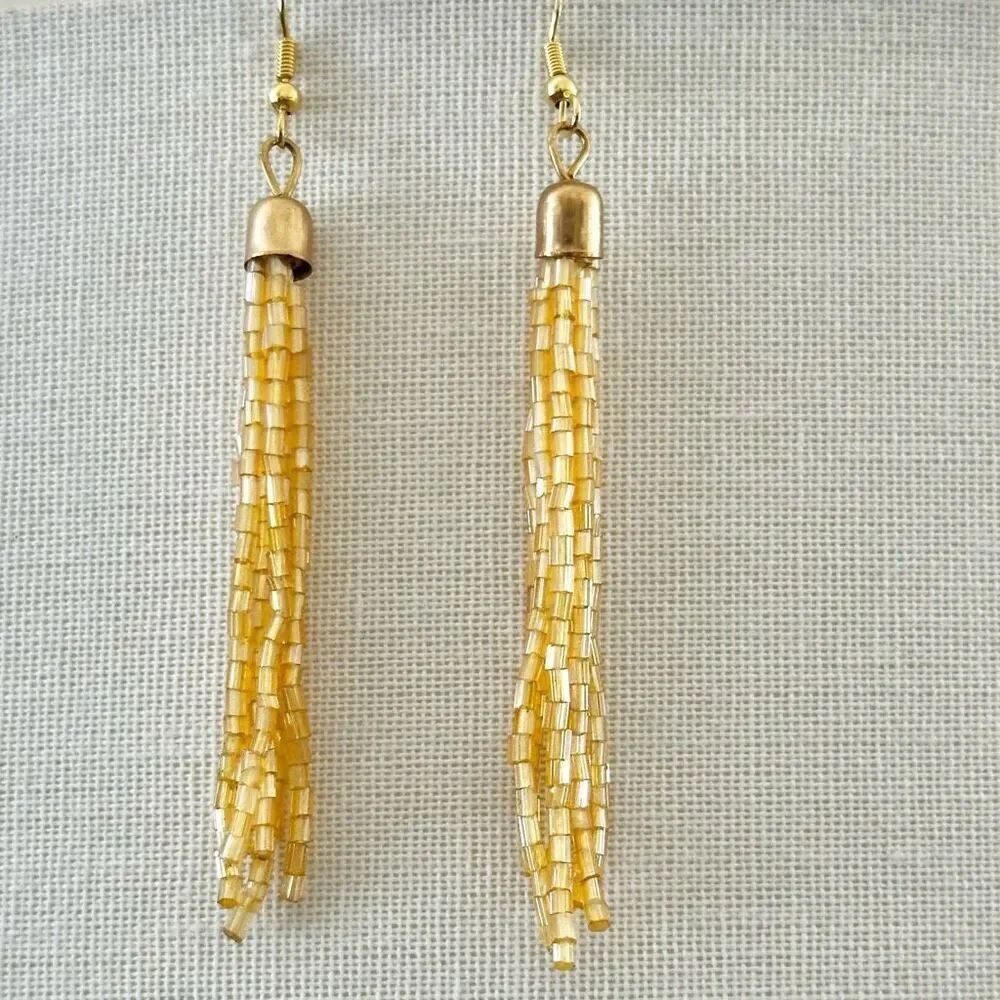 Gold tone yellow beaded fringe earrings